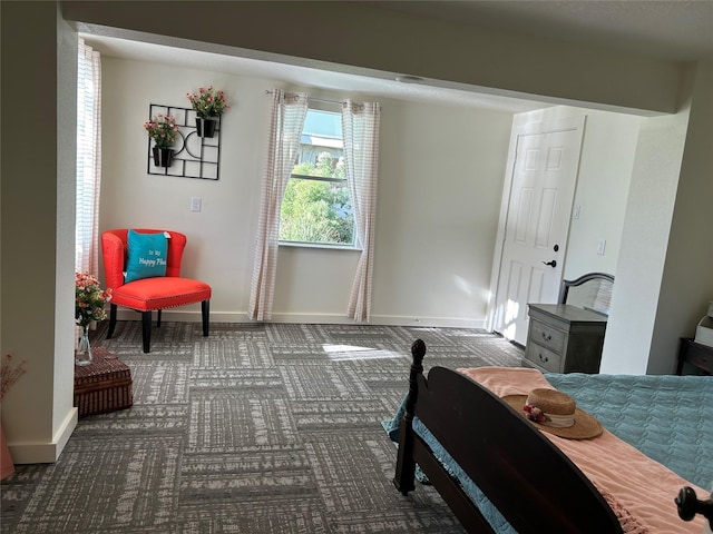 bedroom with baseboards and carpet floors
