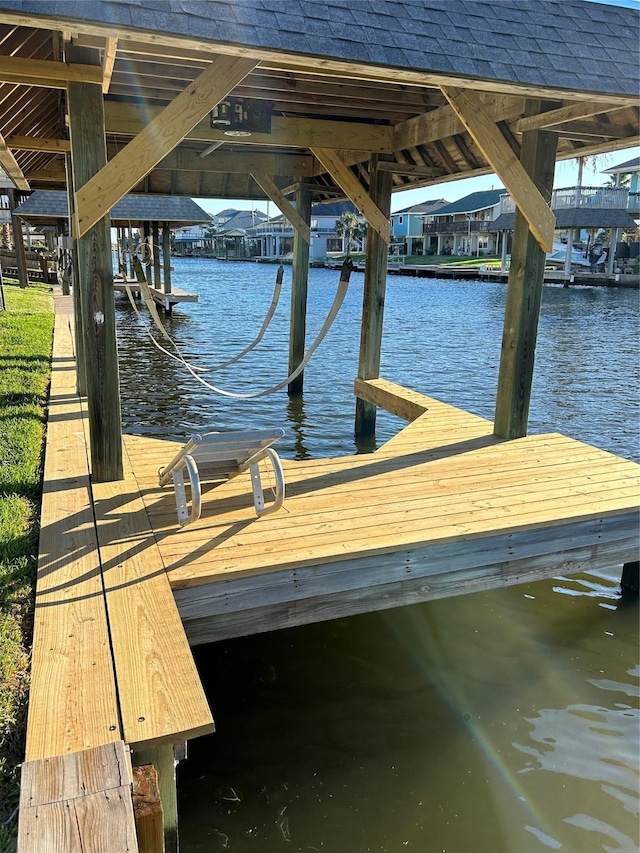 view of dock with a water view and boat lift