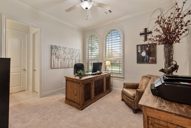 home office with visible vents, crown molding, baseboards, light colored carpet, and a ceiling fan