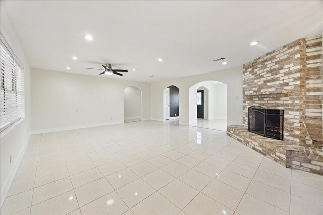 unfurnished living room with visible vents, a ceiling fan, recessed lighting, and a fireplace