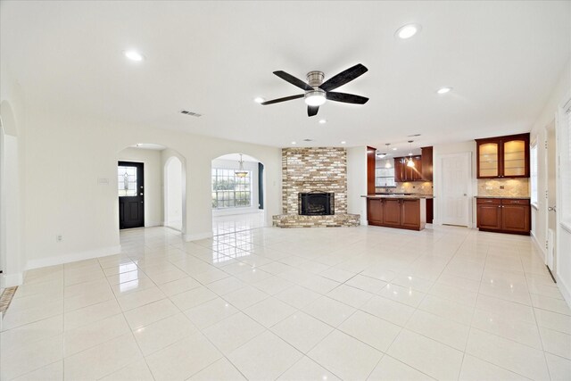 unfurnished living room with visible vents, recessed lighting, ceiling fan, and light tile patterned floors