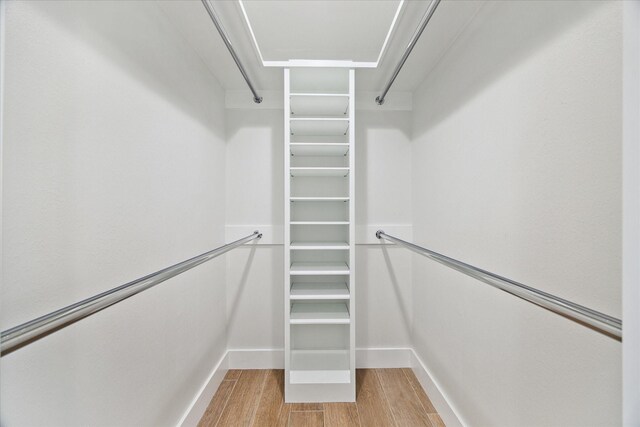 spacious closet featuring light wood-type flooring