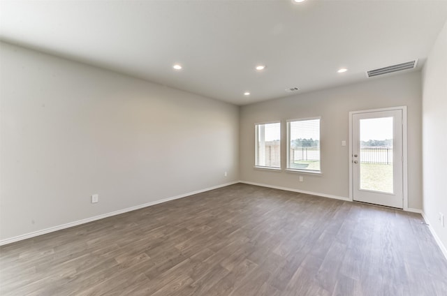 16524 Cascading Pines Ct, Conroe, TX 77302 - empty room with recessed lighting, baseboards, visible vents, and dark wood finished floors