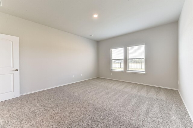 16524 Cascading Pines Ct, Conroe, TX 77302 - carpeted empty room featuring baseboards and recessed lighting