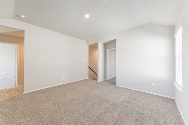 16524 Cascading Pines Ct, Conroe, TX 77302 - empty room with baseboards, lofted ceiling, and light carpet