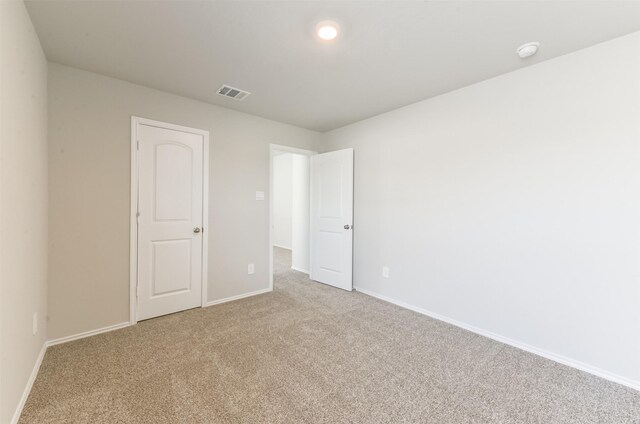 16524 Cascading Pines Ct, Conroe, TX 77302 - unfurnished bedroom with carpet floors, baseboards, and visible vents