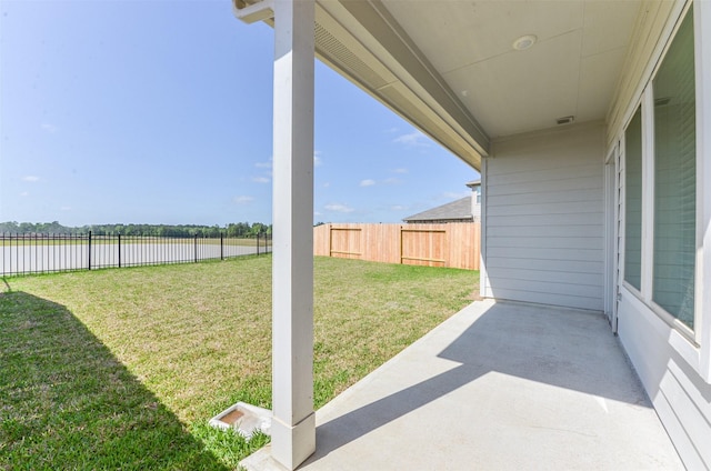 16524 Cascading Pines Ct, Conroe, TX 77302 - view of yard with a water view, a fenced backyard, and a patio area