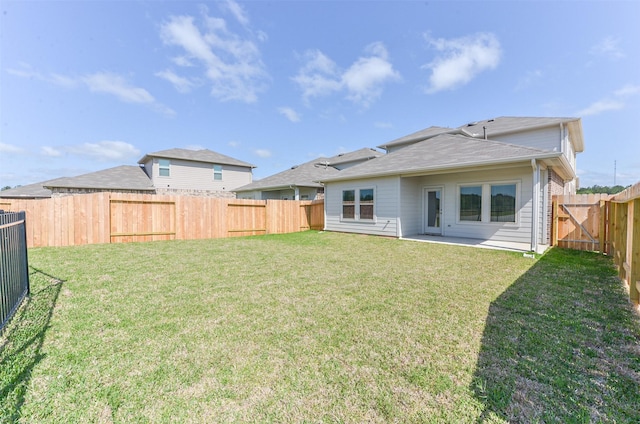 16524 Cascading Pines Ct, Conroe, TX 77302 - rear view of house featuring a patio, a fenced backyard, and a yard