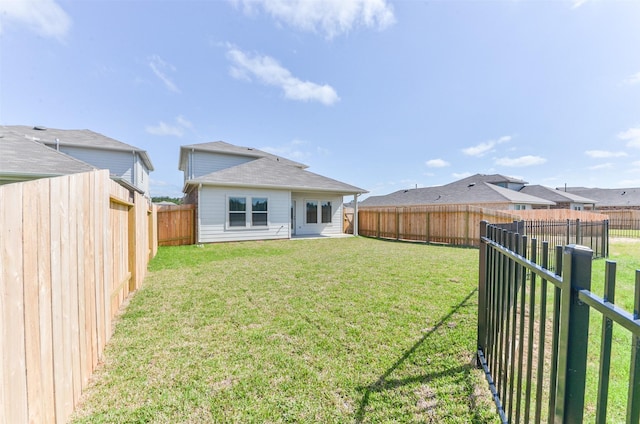 16524 Cascading Pines Ct, Conroe, TX 77302 - rear view of property with a lawn and a fenced backyard