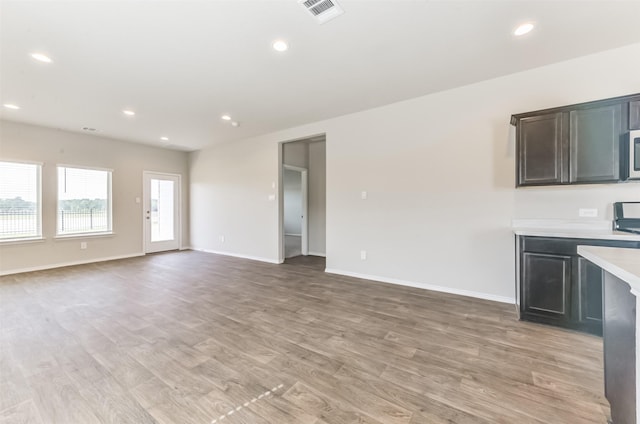 16524 Cascading Pines Ct, Conroe, TX 77302 - interior space with recessed lighting, baseboards, light wood-type flooring, and visible vents