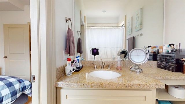 bathroom featuring vanity and a shower with curtain