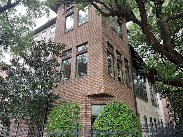 view of property featuring fence