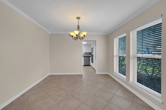 unfurnished dining area with baseboards, ornamental molding, light tile patterned floors, and a notable chandelier