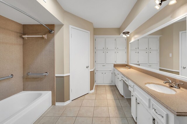 full bath with double vanity, a sink, tile patterned flooring, and shower / bathing tub combination