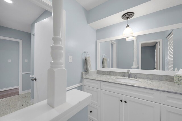 bathroom featuring baseboards and vanity