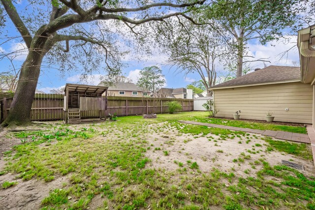 view of yard featuring a fenced backyard