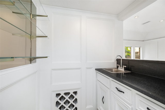 bar featuring recessed lighting and a sink