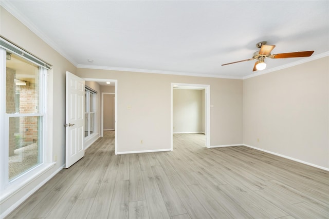 unfurnished room featuring light wood-type flooring, a ceiling fan, baseboards, and a healthy amount of sunlight