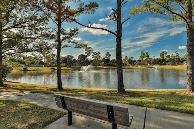 surrounding community featuring a water view
