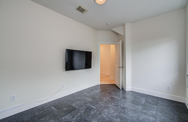 402 Parker St, Houston, TX 77007 - interior space featuring baseboards, stone finish floor, and visible vents