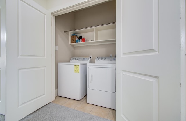 402 Parker St, Houston, TX 77007 - laundry area with laundry area, washer and clothes dryer, and light tile patterned floors
