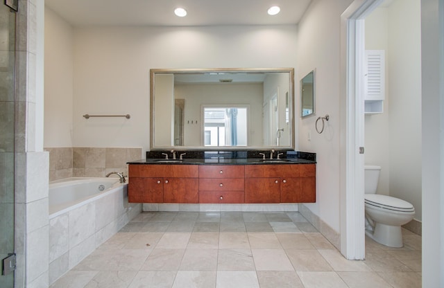 402 Parker St, Houston, TX 77007 - full bath with double vanity, a sink, a bath, and toilet