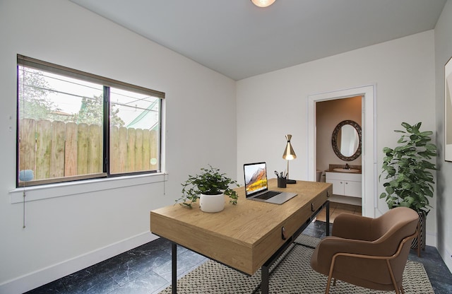 402 Parker St, Houston, TX 77007 - home office featuring a sink and baseboards