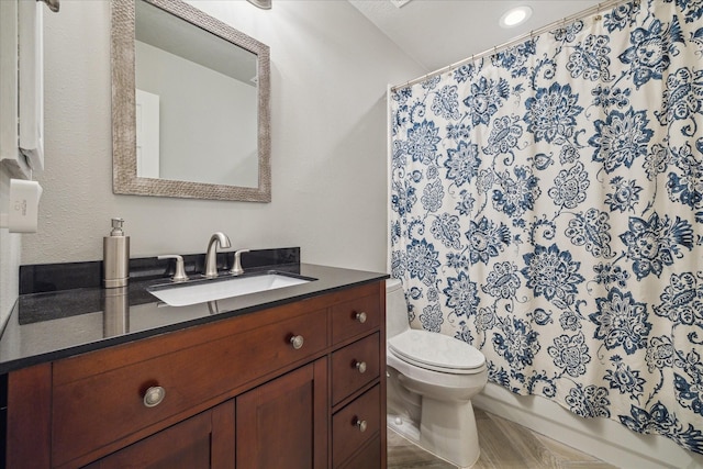 bathroom with recessed lighting, vanity, toilet, and a shower with shower curtain