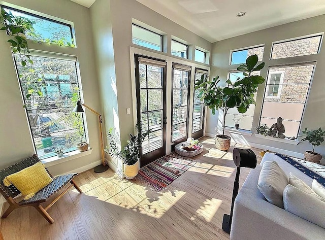 sunroom / solarium featuring french doors