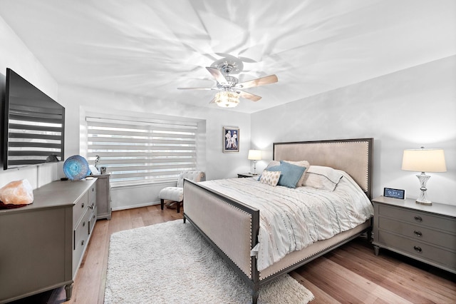 bedroom featuring a ceiling fan and light wood-style flooring