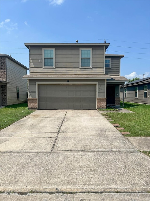 traditional home featuring brick siding, an attached garage, driveway, and a front lawn