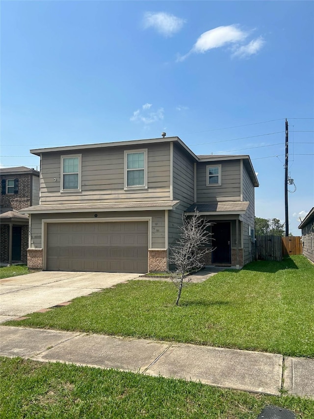 traditional home with fence, an attached garage, a front lawn, brick siding, and concrete driveway
