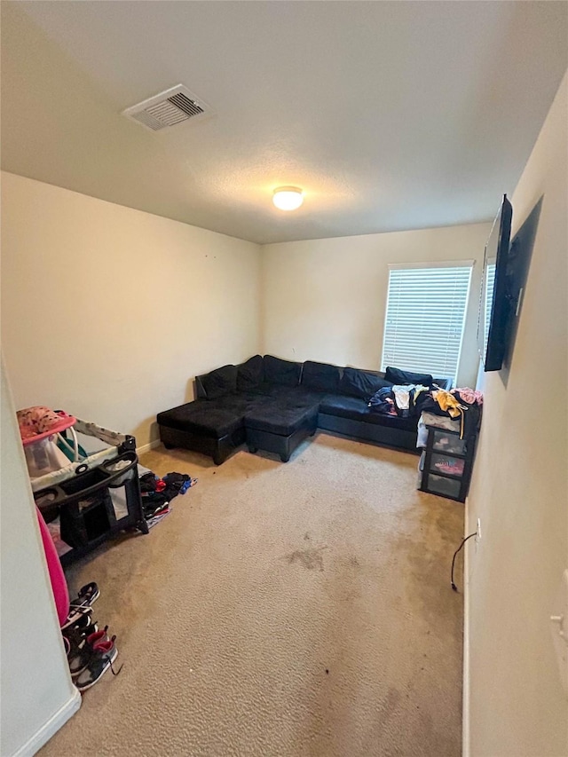 living room with carpet flooring and visible vents