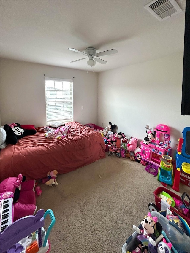 unfurnished bedroom featuring visible vents, carpet, and ceiling fan