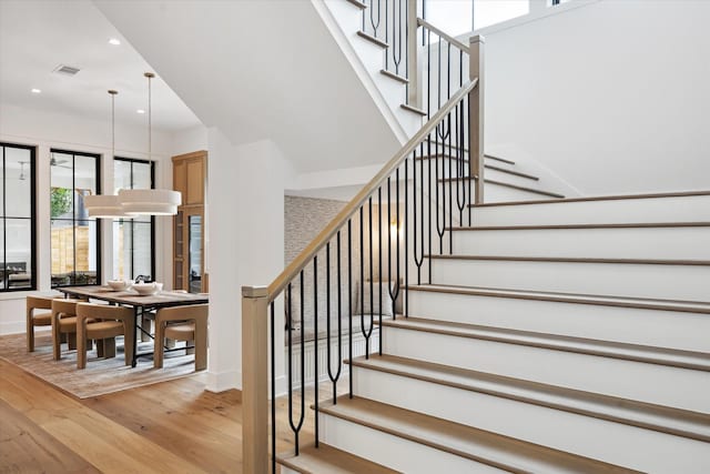 702 E 19th St, Houston, TX 77008 - stairs featuring wood-type flooring, recessed lighting, and baseboards