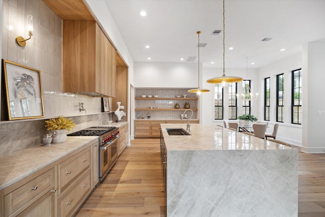 kitchen with open shelves, a sink, range with two ovens, recessed lighting, and modern cabinets