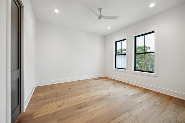 spare room with baseboards, recessed lighting, light wood finished floors, and ceiling fan
