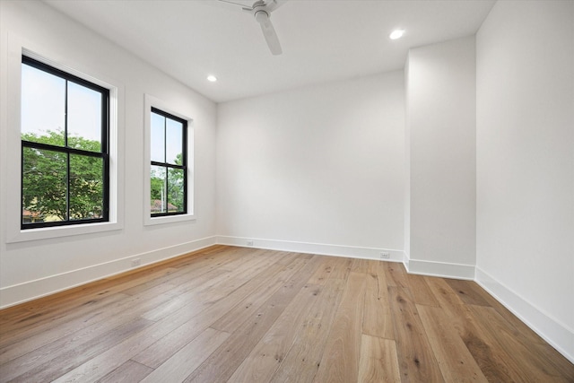 spare room with a ceiling fan, baseboards, recessed lighting, and light wood finished floors