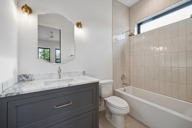 bathroom with toilet, plenty of natural light, bathing tub / shower combination, and vanity