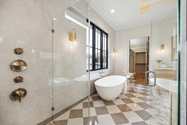 702 E 19th St, Houston, TX 77008 - full bathroom with a stall shower, a soaking tub, tile patterned flooring, and recessed lighting
