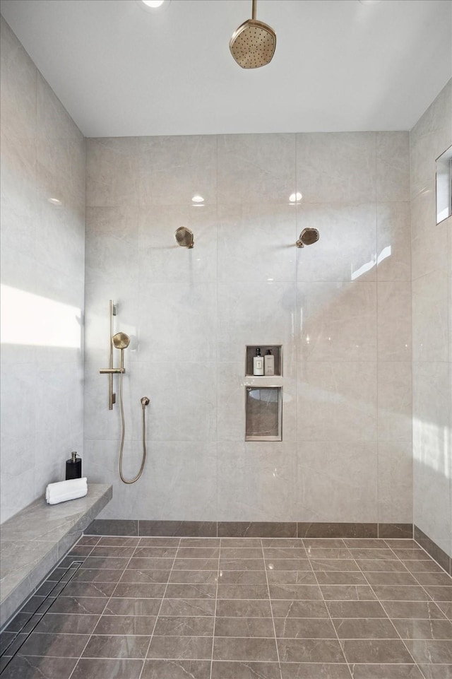 full bathroom with a tile shower