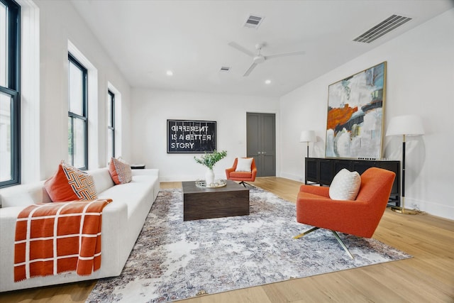 living area with visible vents, a ceiling fan, wood finished floors, and recessed lighting
