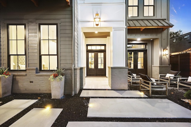 702 E 19th St, Houston, TX 77008 - entrance to property with french doors, metal roof, and a standing seam roof