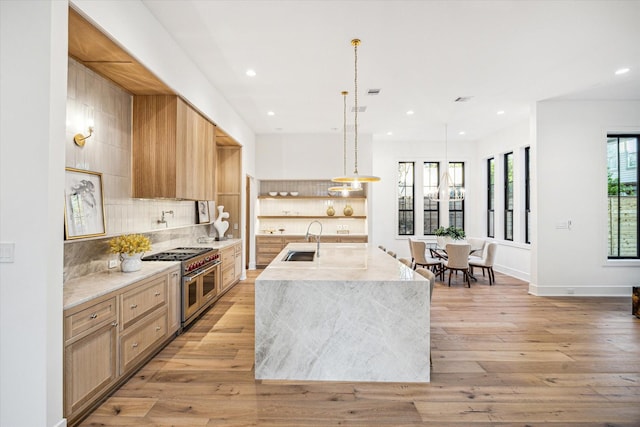 702 E 19th St, Houston, TX 77008 - kitchen with double oven range, open shelves, recessed lighting, tasteful backsplash, and a sink