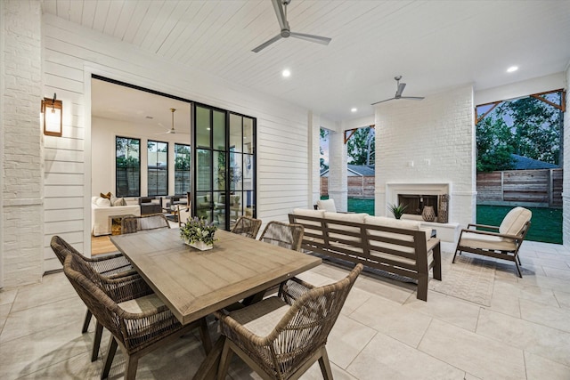 702 E 19th St, Houston, TX 77008 - view of patio featuring an outdoor living space with a fireplace, ceiling fan, fence, and outdoor dining space