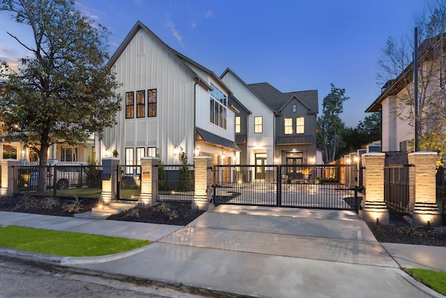 702 E 19th St, Houston, TX 77008 - view of front of home with a gate, board and batten siding, and a fenced front yard