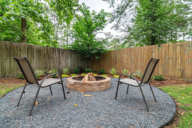 view of patio with a fenced backyard and an outdoor fire pit