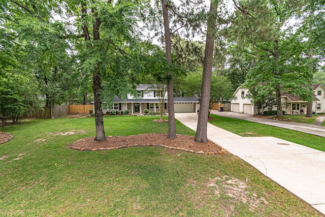 traditional-style house featuring fence and a front yard
