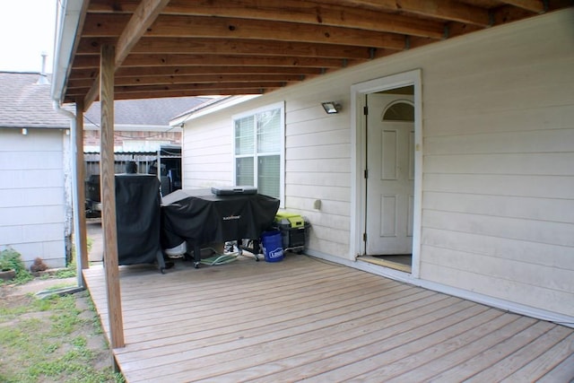 deck with fence and area for grilling