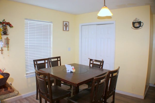 7721 Brumblay St, Houston, TX 77012 - dining space featuring baseboards and wood finished floors